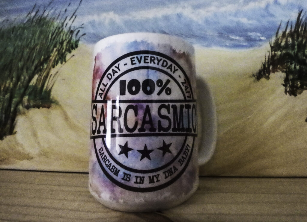 Mug with "100% Sarcasm" humorous design.