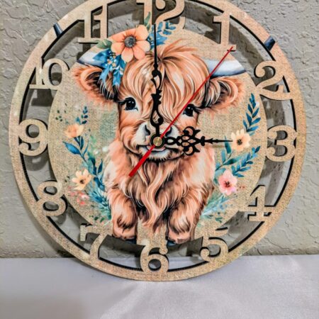 A wooden clock featuring a colorful baby elephant design.